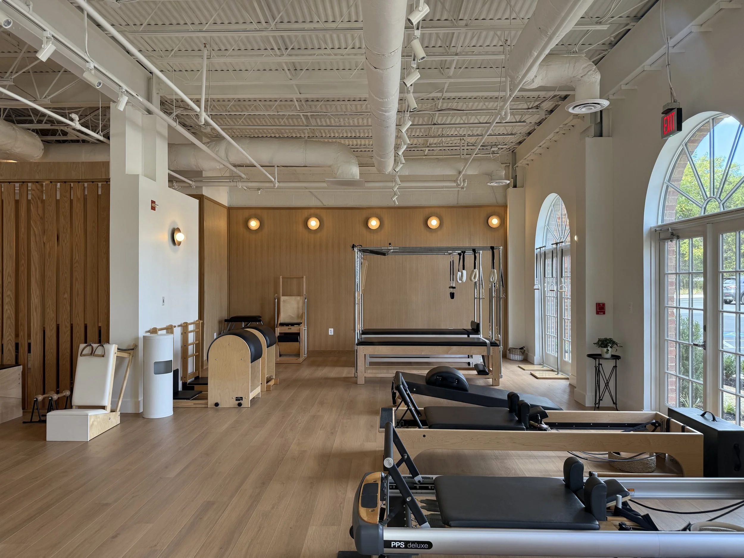 The bright Great Falls Pilates studio with reformers and classical apparatus