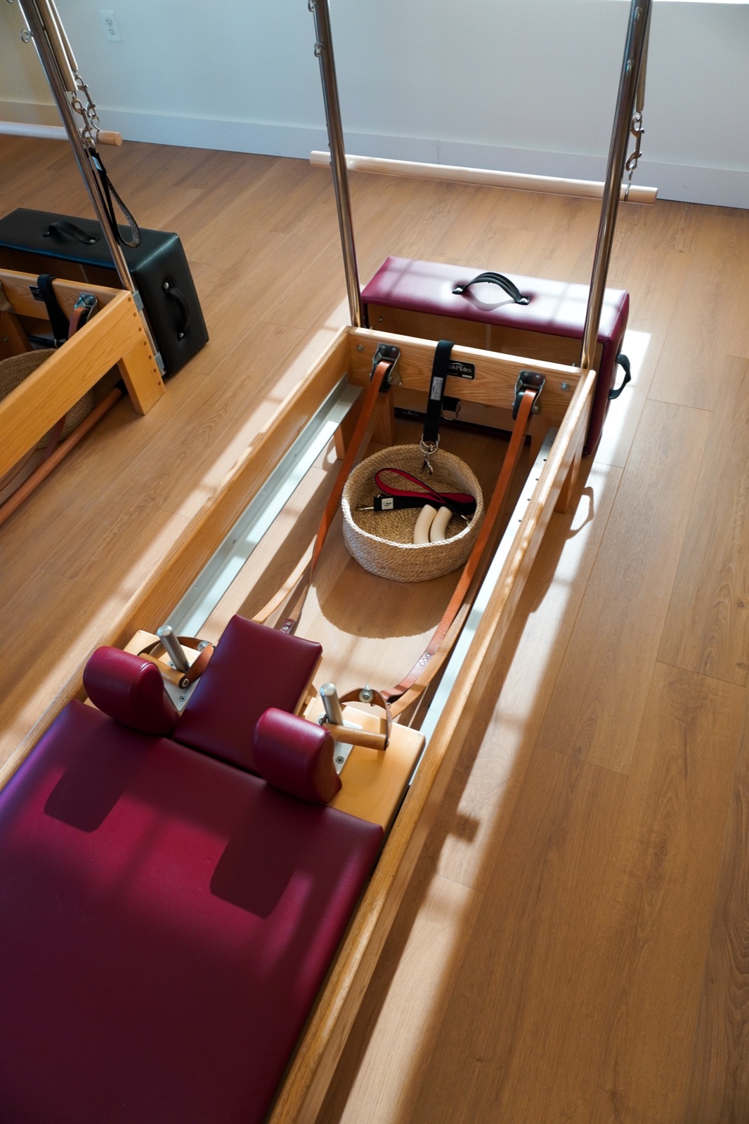 A close view of the reformer carriage, straps, and springs