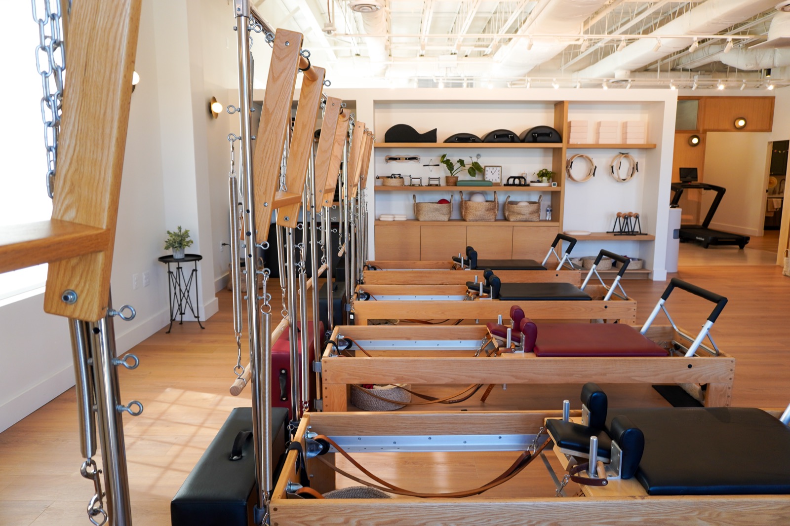 A row of reformers and tower springs in the Great Falls studio